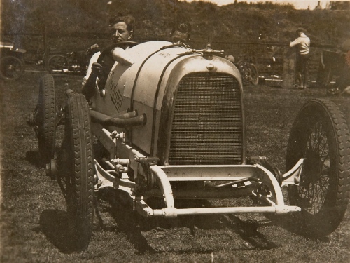 Don Harkness at the wheel of his Overland Sports car %22Whitey%22, 1925